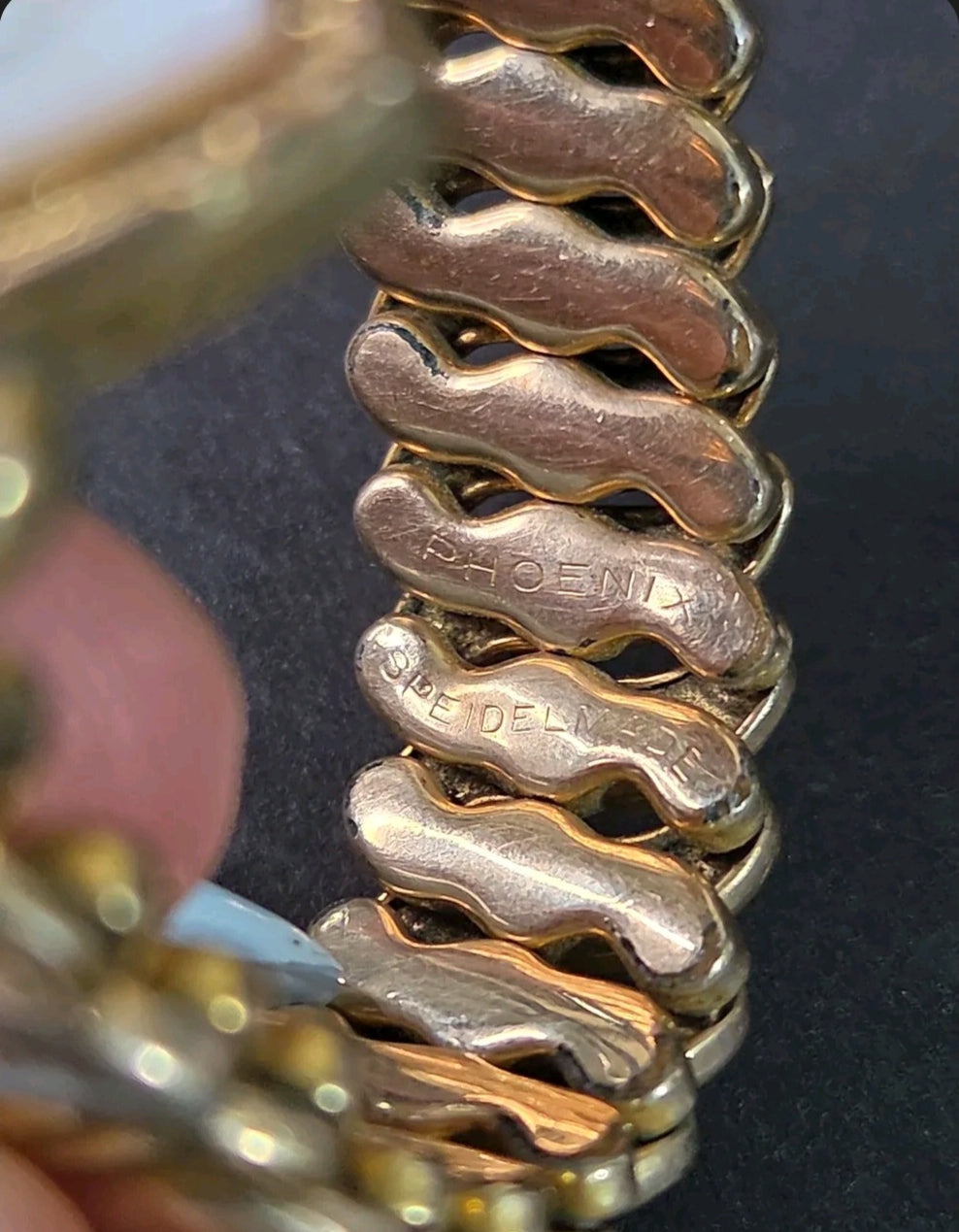 Oddly Darling Vintage Speidel Phoenix gold-tone expansion bracelet showing engraved links and flexible construction