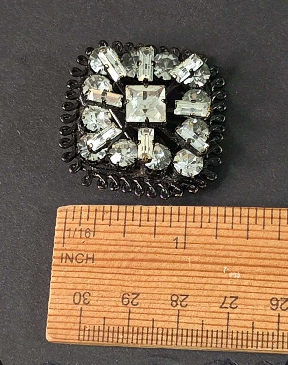 Oddly Darling Vintage square brooch with clear crystals and gunmetal setting, featuring baguette and round stones.