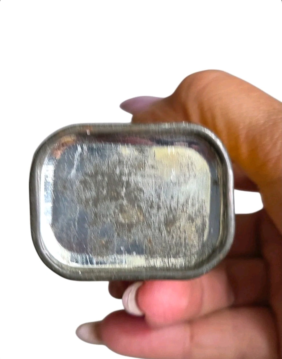 Oddly Darling Vintage Sudan Brand celery seed tin base showing weathered metal patina held in a hand