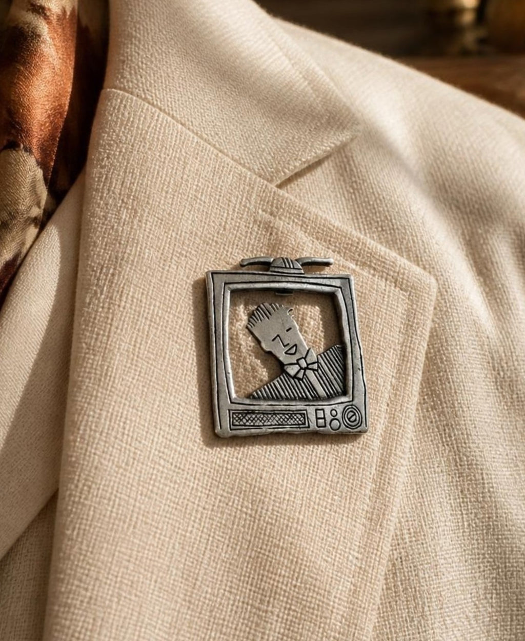 Oddly Darling Vintage silver-tone metal brooch featuring a retro television set with a character on the screen.