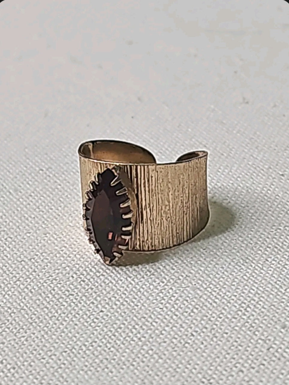 Oddly Darling Vintage wide textured gold-tone statement ring with a dark marquise-cut stone in a pronged setting.