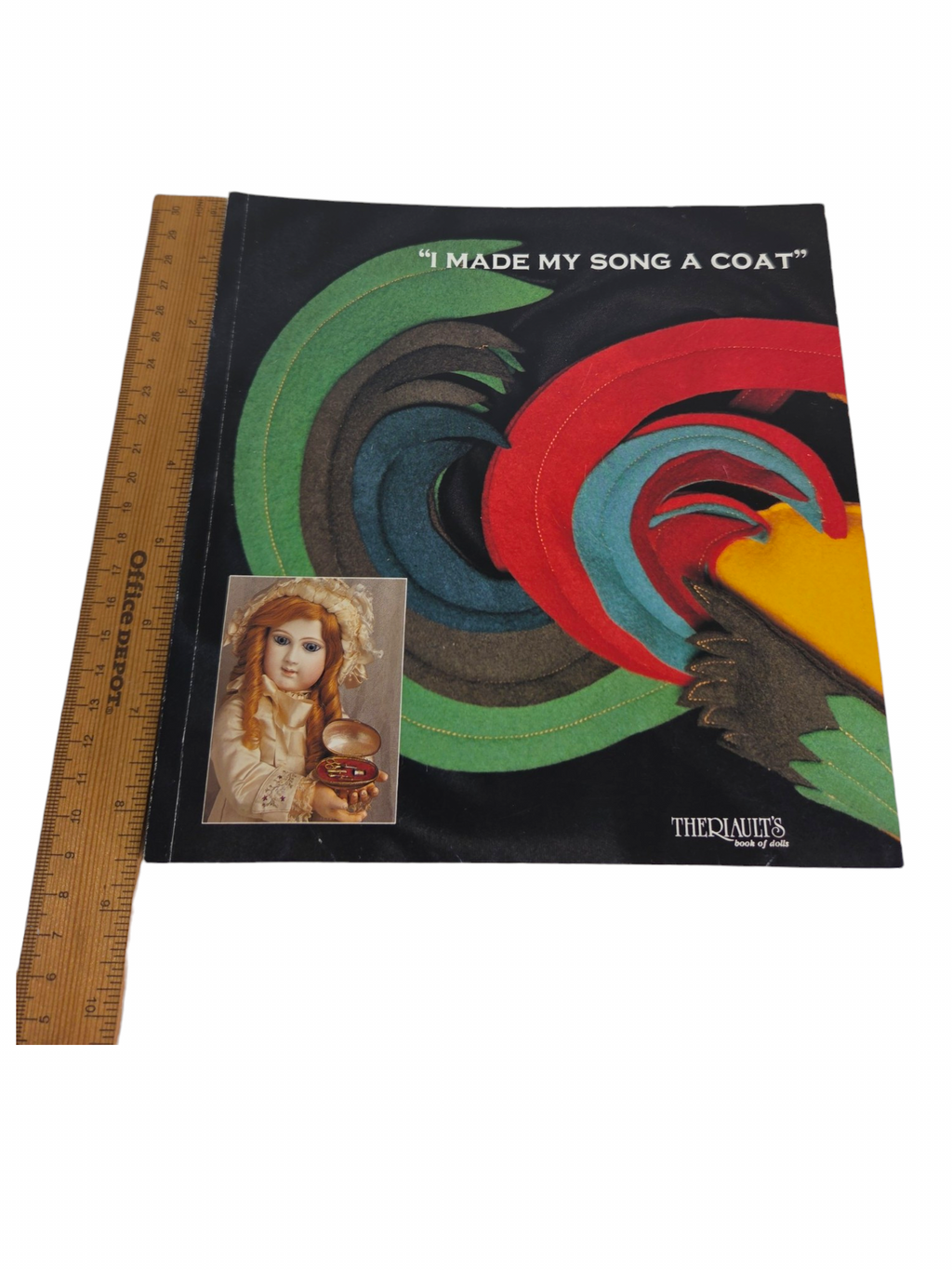 Oddly Darling Vintage Theriault's 1994 I Made My Song a Coat antique doll auction catalogue with a wooden ruler.