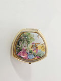 Oddly Darling Vintage triangular gold-tone compact ring featuring a colorful pastoral garden scene on the lid