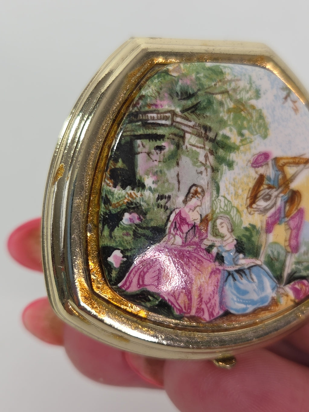 Oddly Darling Vintage gold-tone triangular ring with a colorful pastoral scene lid and functional mirror interior
