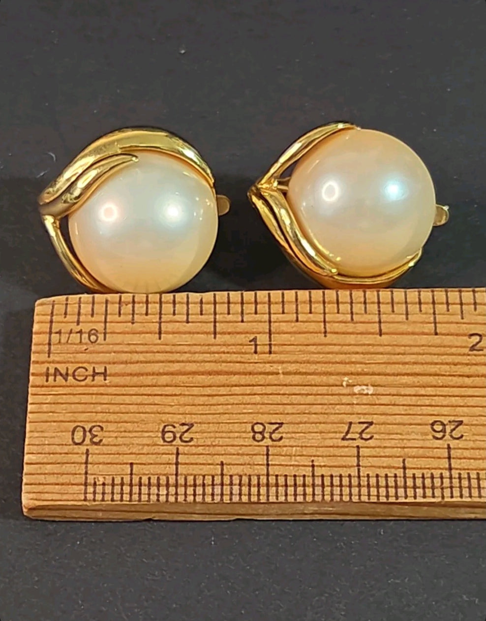 Oddly Darling Vintage Trifari clip-on earrings featuring large faux pearls in a gold-tone leaf metal setting