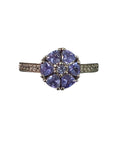 Oddly Darling Vintage floral cluster ring featuring violet gemstones in a flower motif with shimmering accent stones.