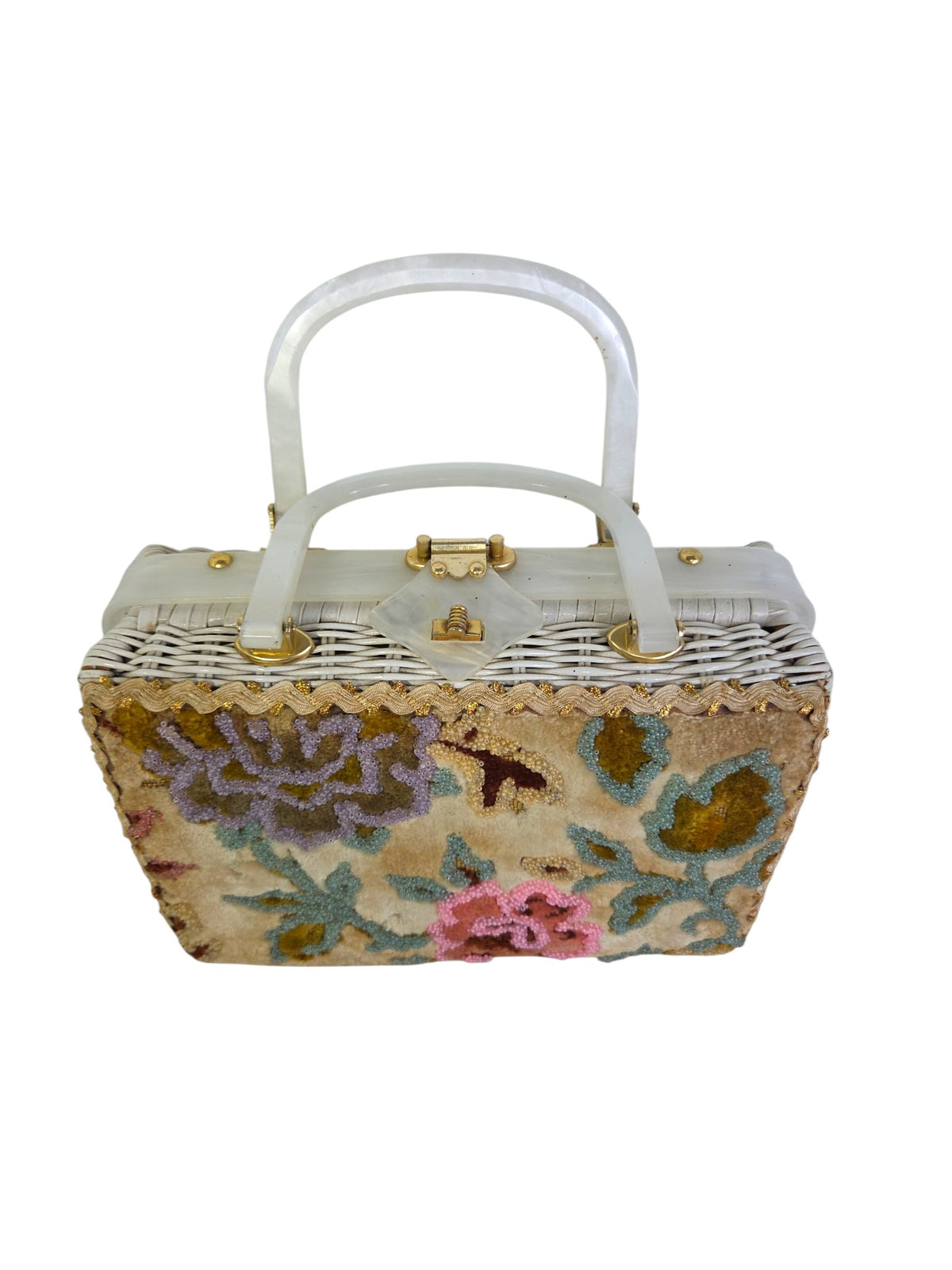 Top-down view of the Tropic wicker purse showing both pearlized Lucite handles, Lucite top trim and diamond clasp tab