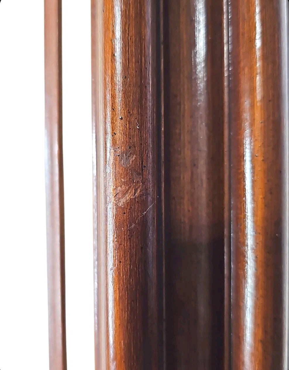 Close-up of the dark wood frame on an Oddly Darling Vintage horse portrait painting showing wood grain and texture.