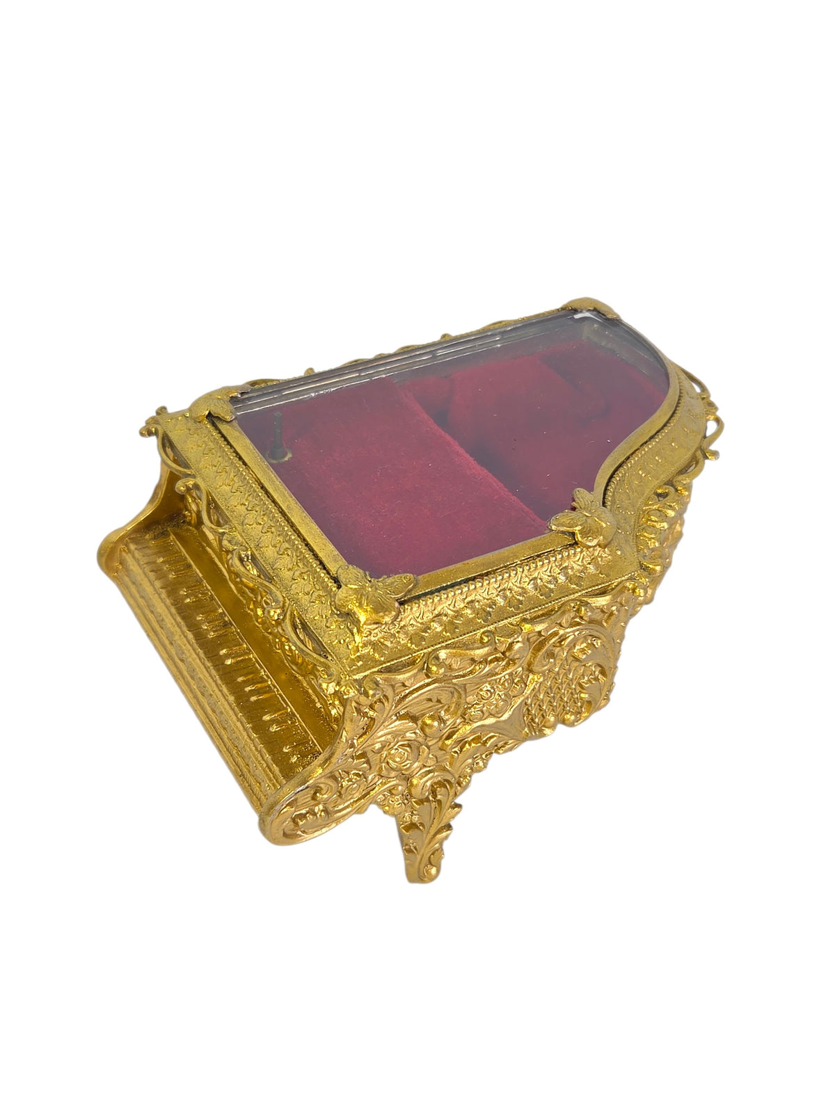Vintage gold-tone ormolu grand piano jewelry box open, showing the mirror inside the lid and red velvet lining