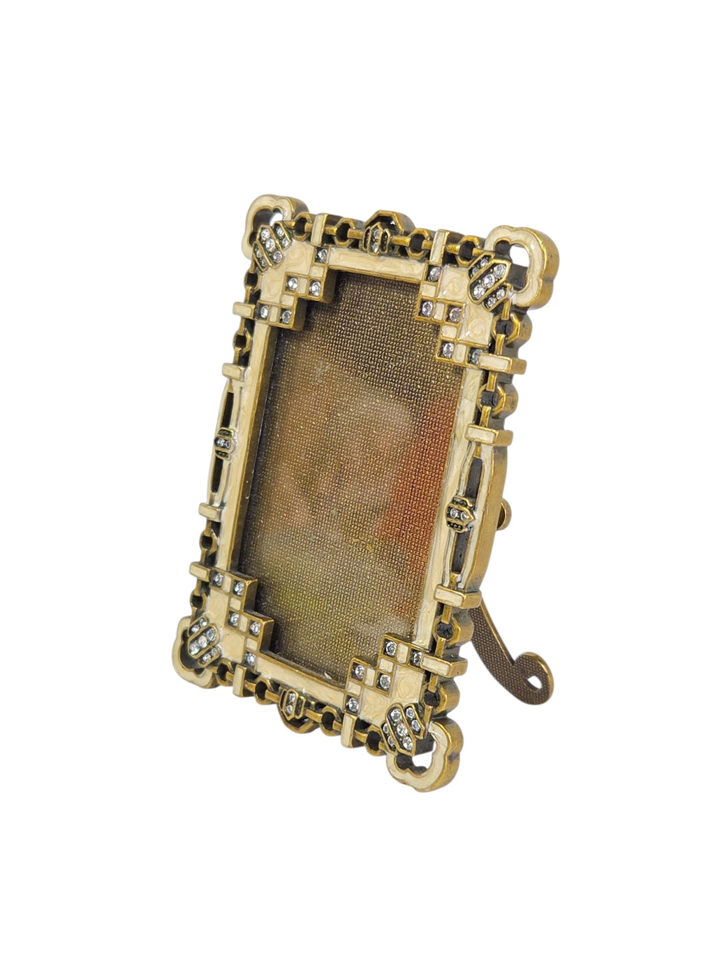 Argento enamel frame at an angle, standing on its easel, showing the openwork chain border and crystal corners