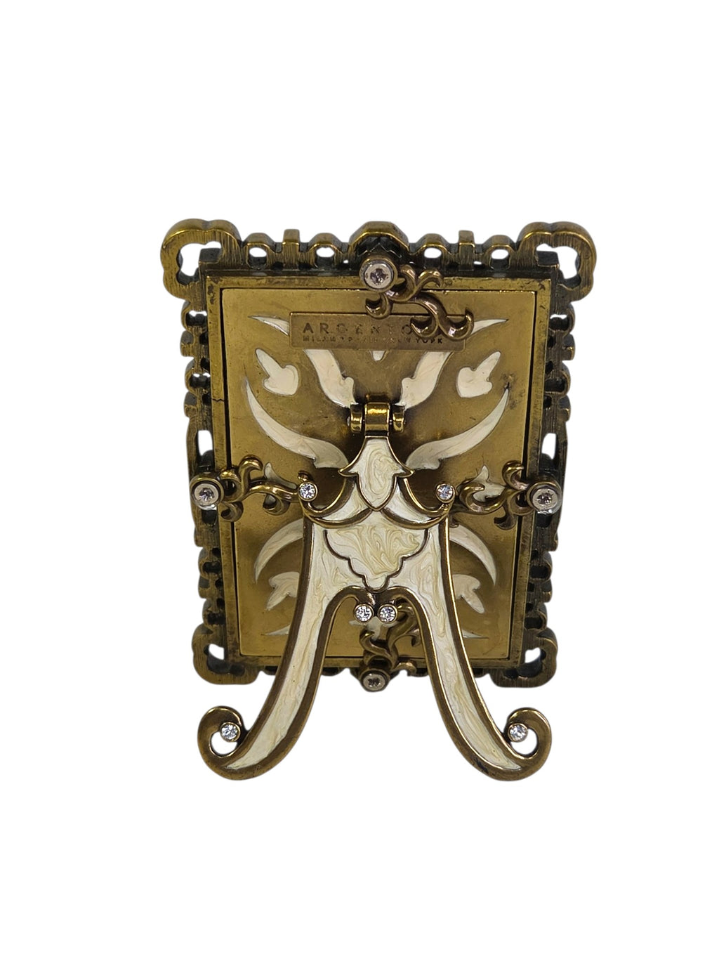 Back of the Argento frame with cream enameled scroll panel, crystal accents and hinged enamel easel