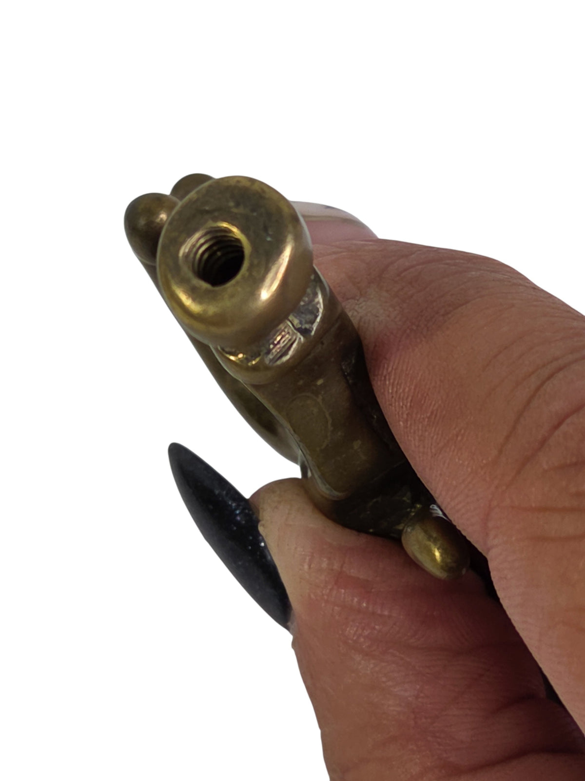 Close-up of the threaded hole in the Pegasus finial's hoof, held between fingers