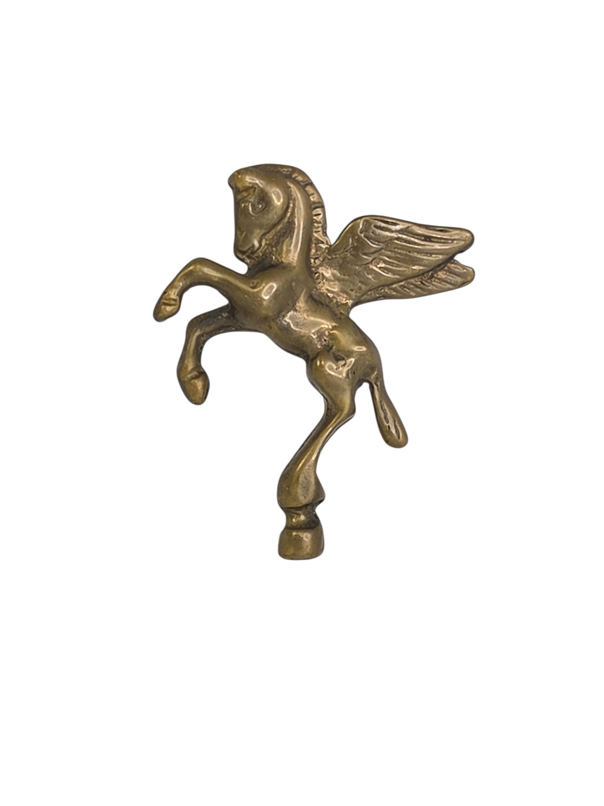 Vintage solid brass Pegasus finial on white, a rearing winged horse facing left with feathered wings and flowing mane
