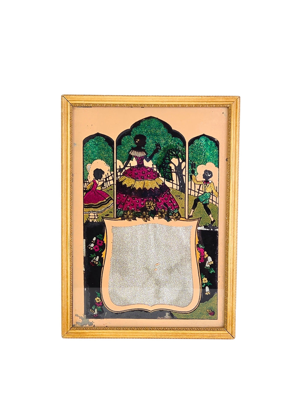 Vintage tinsel art reverse painted glass picture on white: silhouette crinoline lady and children in three arched garden panels above a silver foil shield, in a gold wood frame